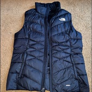 Black North Face vest, size medium.